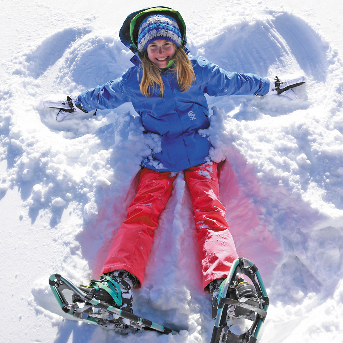 Child snowshoeing in fresh snow in Crested Butte, CO.