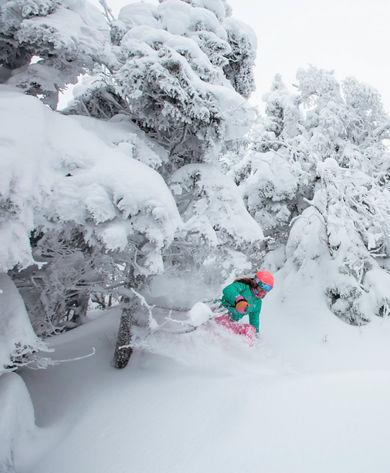 Woman skis fresh snow in Stowe, VT.
