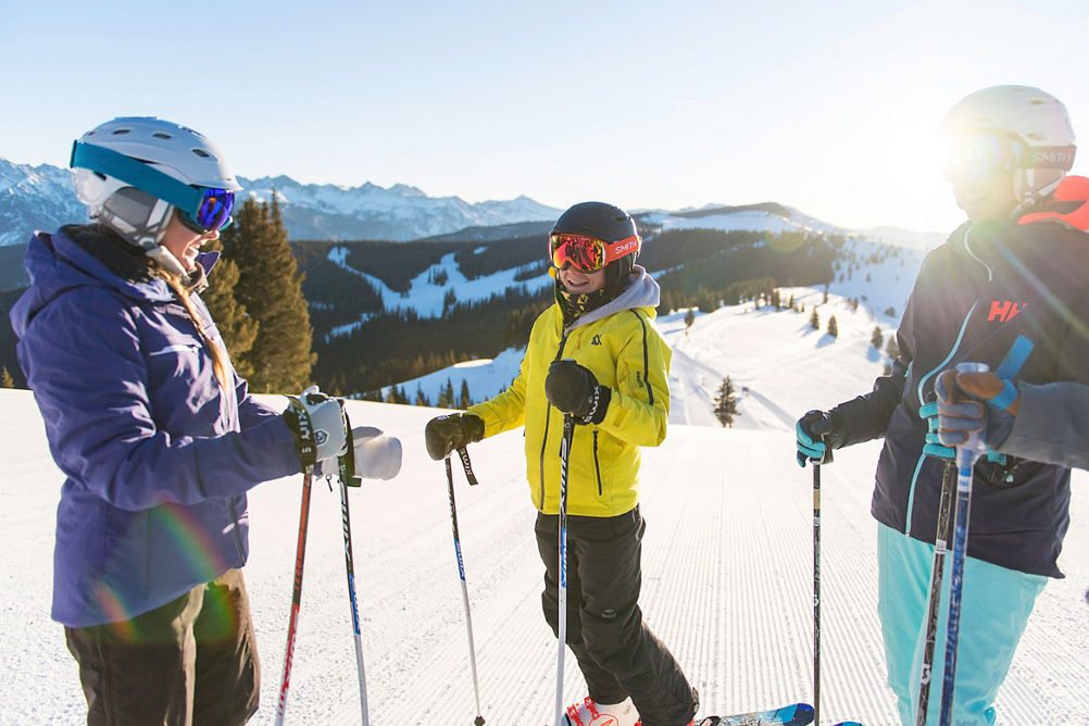 Family skis 5-star groomed trails in the Back Bowls at Vail, CO.