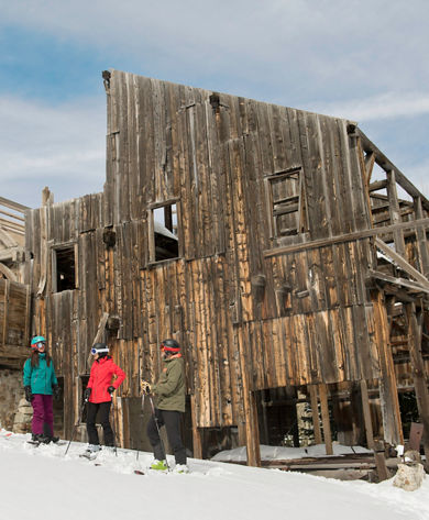 Friends enjoy a ski day together under the sun in Park City, UT.