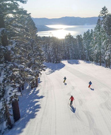 Aerial Photo of Three People Skiing down East Ridge at Northstar California Resort