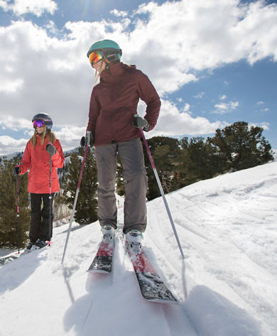 Friends enjoy a ski day together under the sun in Park City, UT.
