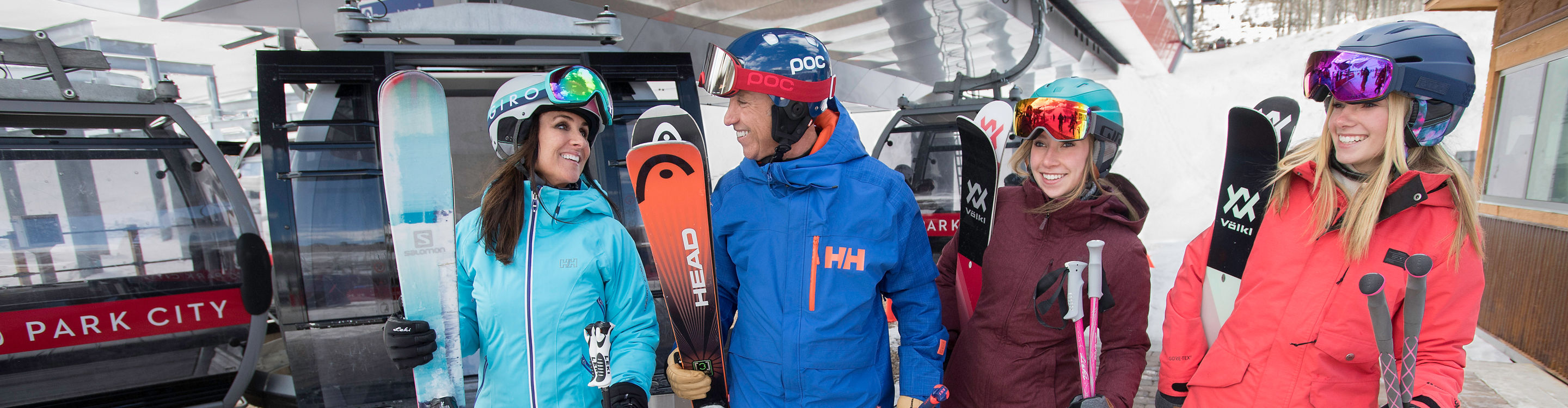 Friends enjoy a ski day together under the sun in Park City, UT.