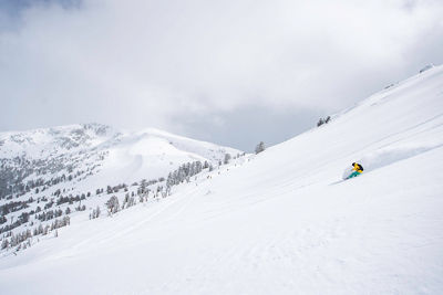 Skier enjoys deep powder in Kirkwood, CA.