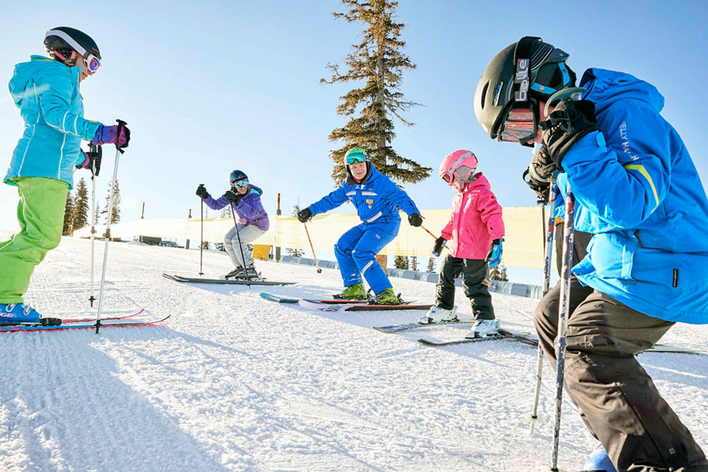 Family has a ski lesson with the Ski and Ride program in Keystone, CO.