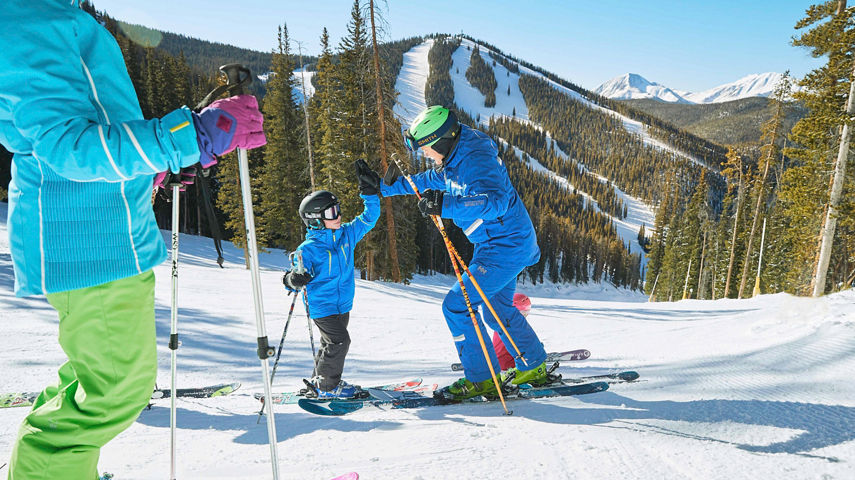 Family has a ski lesson with the Ski and Ride program in Keystone, CO.