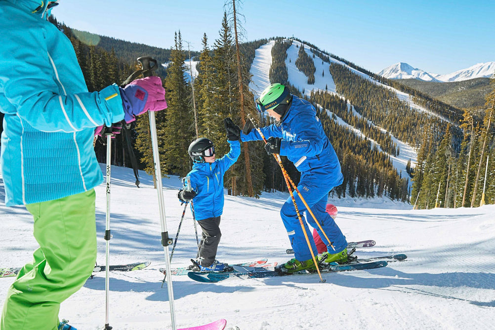 Family has a ski lesson with the Ski and Ride program in Keystone, CO.