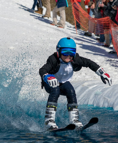 Boy Participates in the Pond Skim at Whitetail