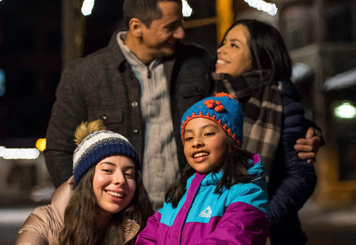 Family walks to firepit in the village of Northstar, CA.