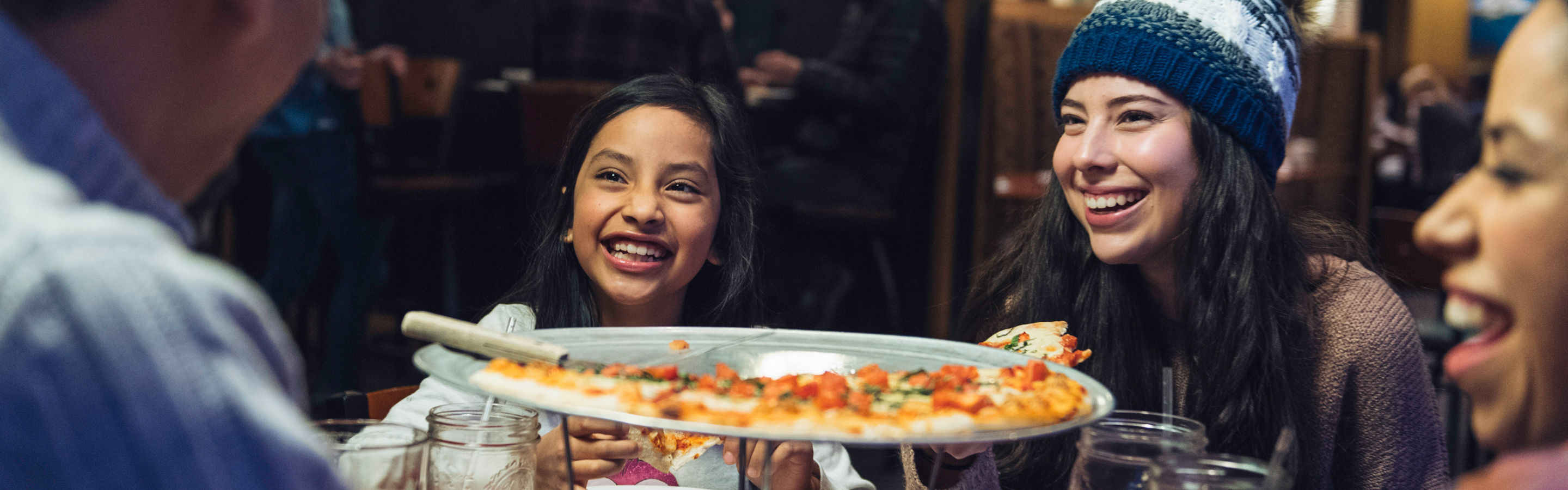 Family gathers to enjoy nightlife in the village of Northar, CA.