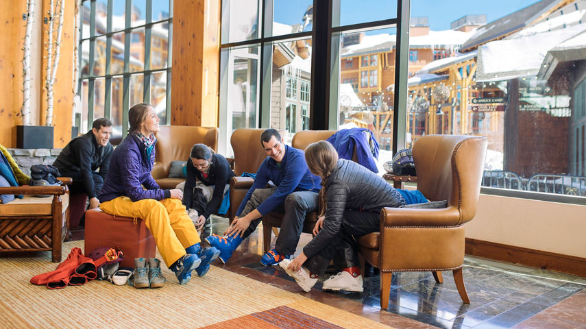 Friends enjoy skiing together in Stowe, VT.