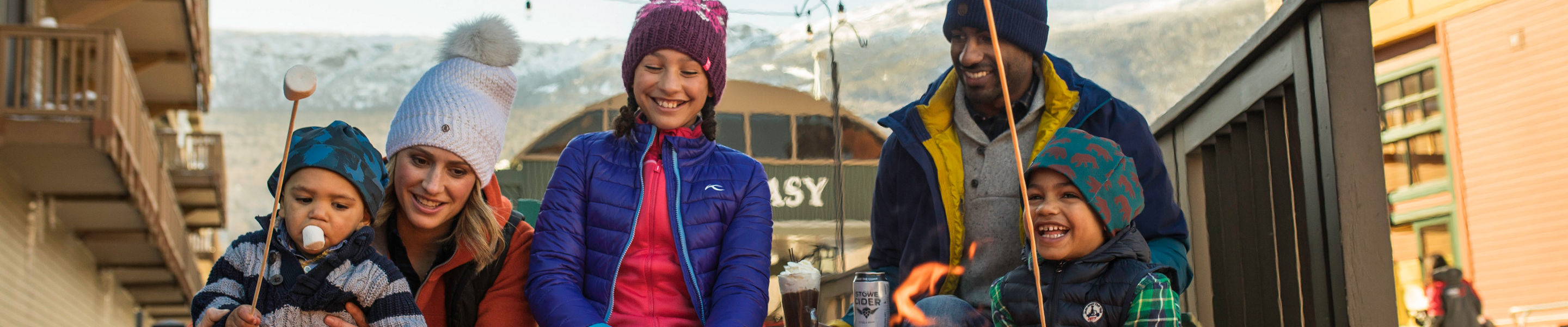 Family Makes S'mores at Spruce Peak Village at Stowe Mountain Resort