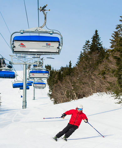 Skier Makes Turns Under the Chairlift at Mount Snow