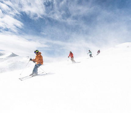 Group of friends ski Imperial Peak in Breckenridge, CO.