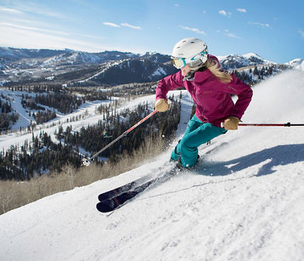 Friends ski together under the sun in Park City, UT.