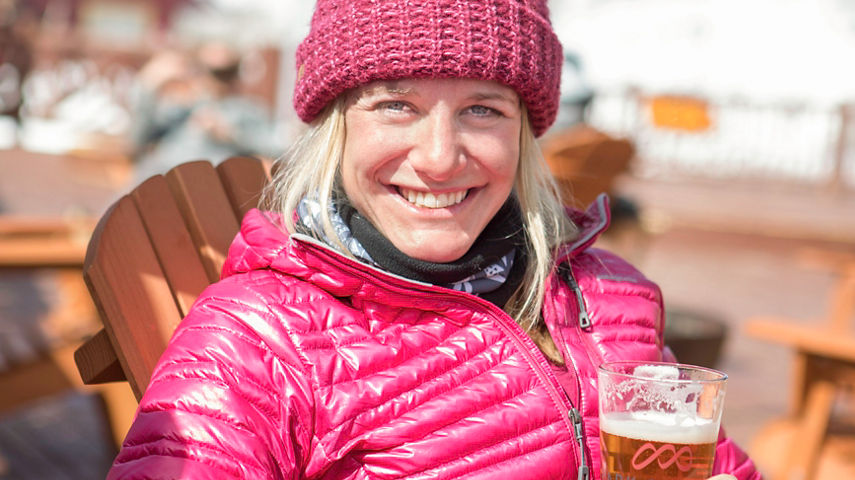 Friends enjoy apres on top of the mountain in Park City, UT.
