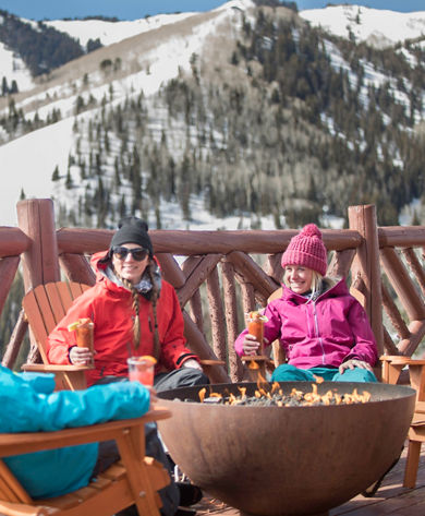Friends enjoy apres at Lookout Cabin in Park City, UT.