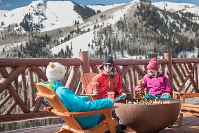 Friends enjoy apres at Lookout Cabin in Park City, UT.