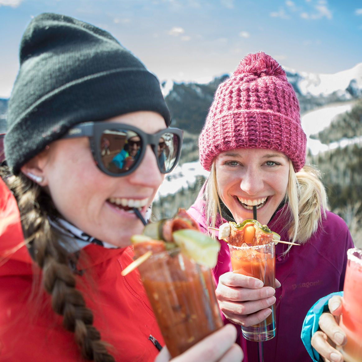 Friends enjoy apres on top of the mountain in Park City, UT.