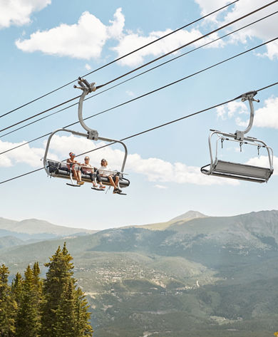 Friends on scenic chairlift ride at Breckenridge