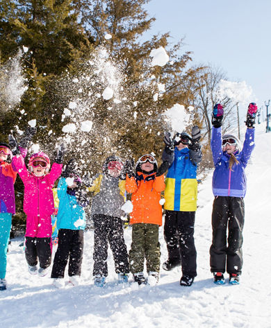 Kids play with fresh snow in Mt. Brighton, MI.