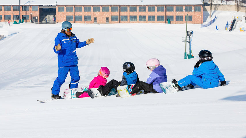 Children's snowboard school lesson in Mt. Brighton, MI.