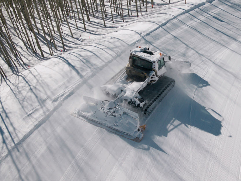 Aerial view of snowcat in Beaver Creek, CO.