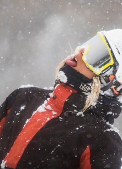 A guest enjoys snowfall at Heavenly Valley at Hotham