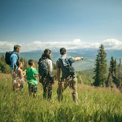Family on a Mountain Hostd hike through the mountains in Beaver Creek, CO.