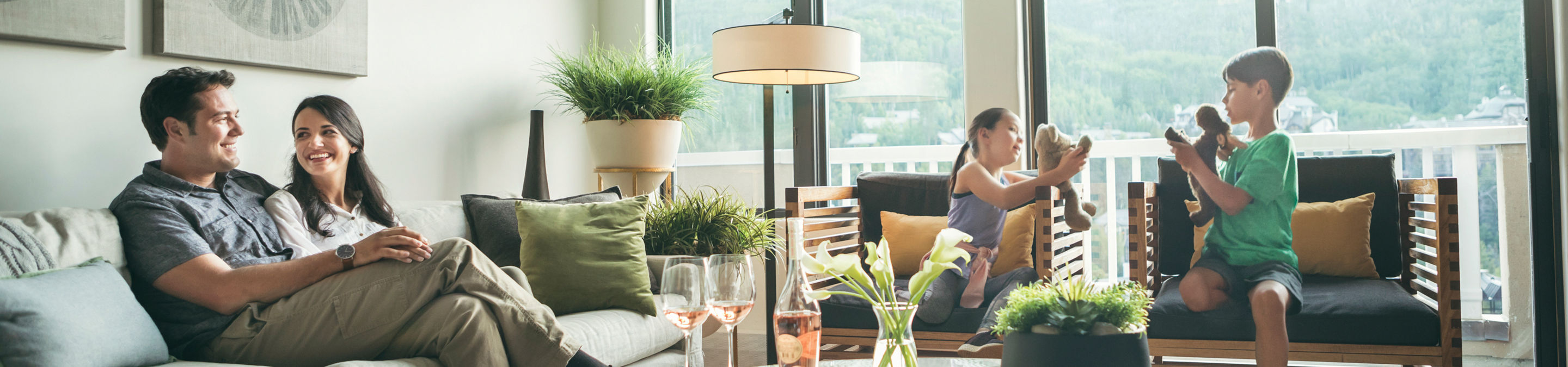 Family relaxes in the living room of The St James in Beaver Creek, CO.