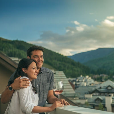 Couple takes in the sunset at The St James in Beaver Creek, CO.