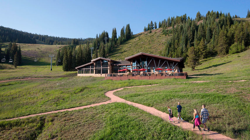 Family enjoys a walk near The 10th restaurant in Vail, CO