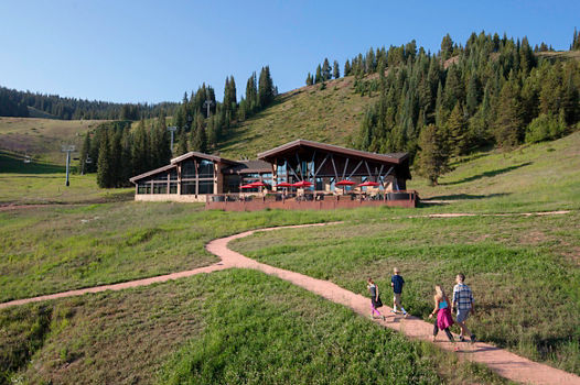 Family enjoys a walk near The 10th restaurant in Vail, CO