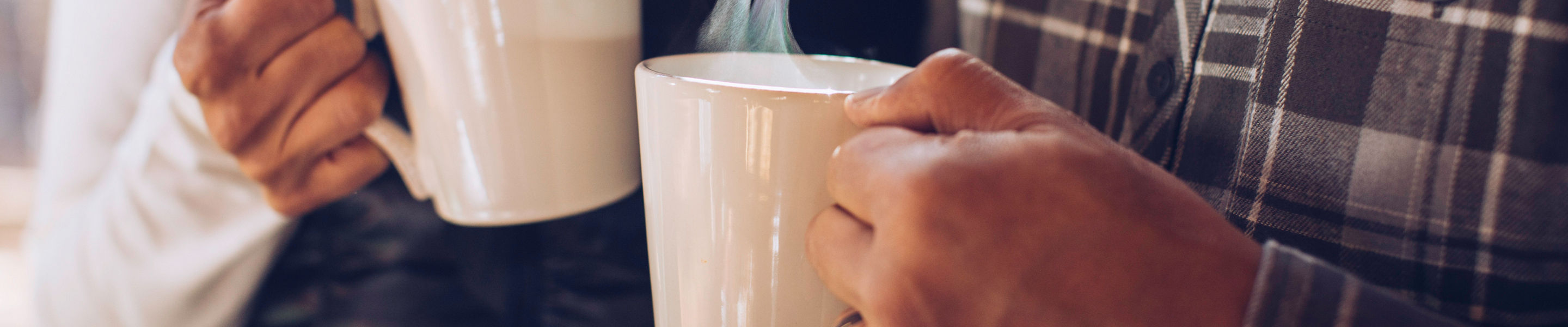 A couple enjoys freshly brewed coffee at their lodge in Northstar, CA.