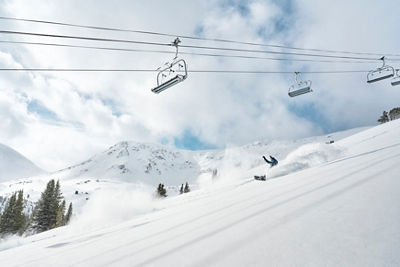 Snowboarders slash powder on Peak 6 at Breck