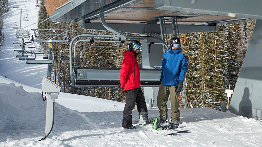 Snowboarders at the Kensho Express Super Chair at Breck