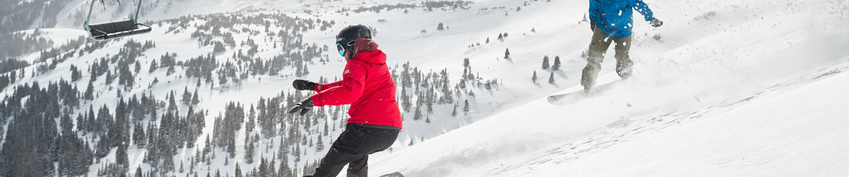 Snowboarders slash powder on Peak 6 at Breck