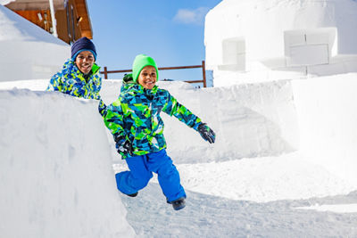 Family enjoys the opening of the Kidtopia snow fort in Keystone, CO. 