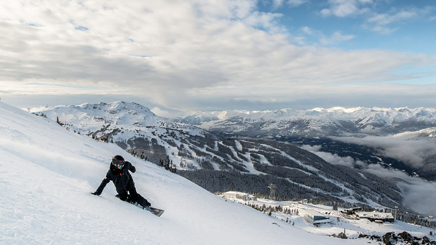 Matt Sylvestre Snowboarding with Whistler Mountain in the background