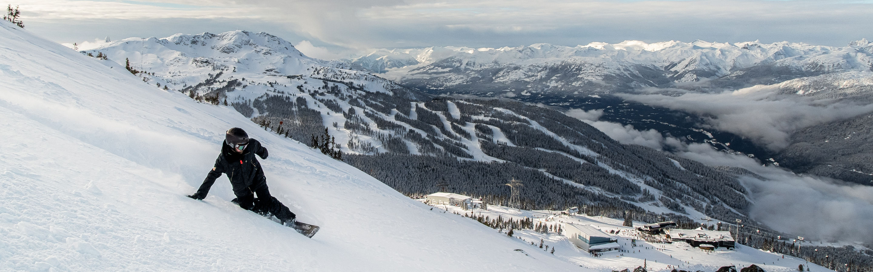 Matt Sylvestre Snowboarding with Whistler Mountain in the background