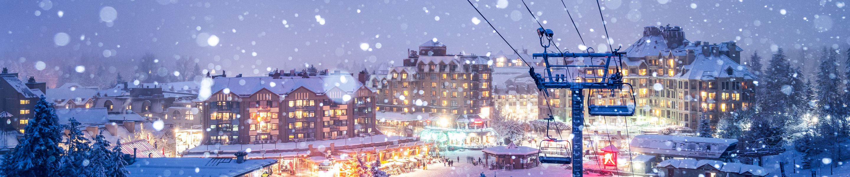 Snowy Whistler Village Glowing at Night