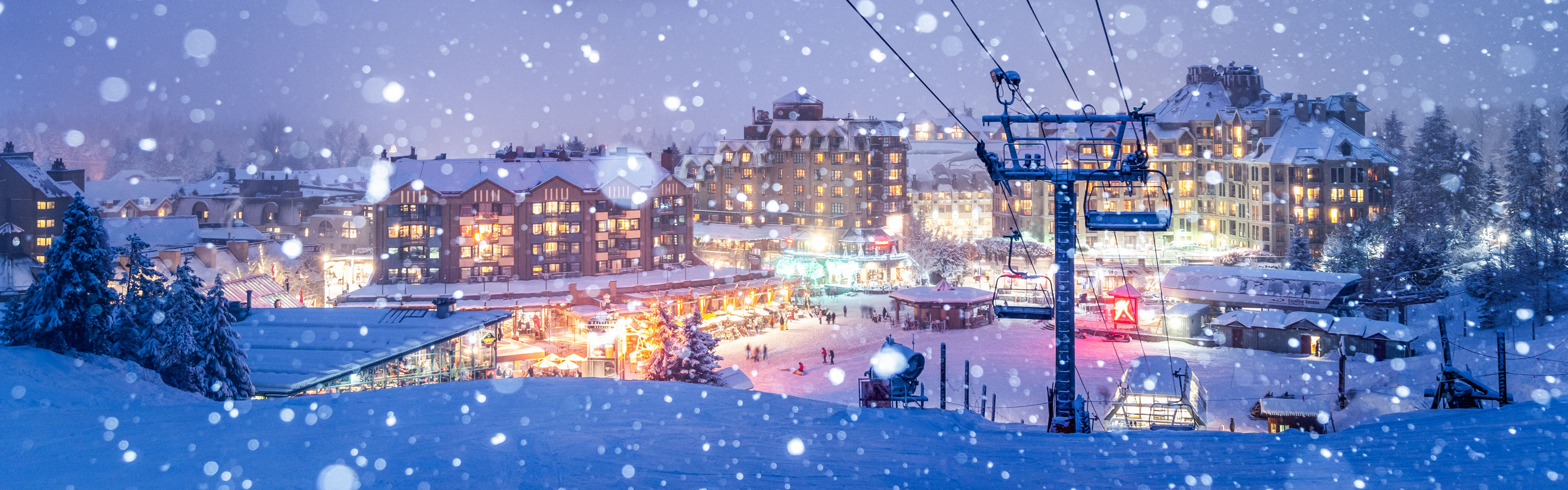 Snowy Whistler Village Glowing at Night