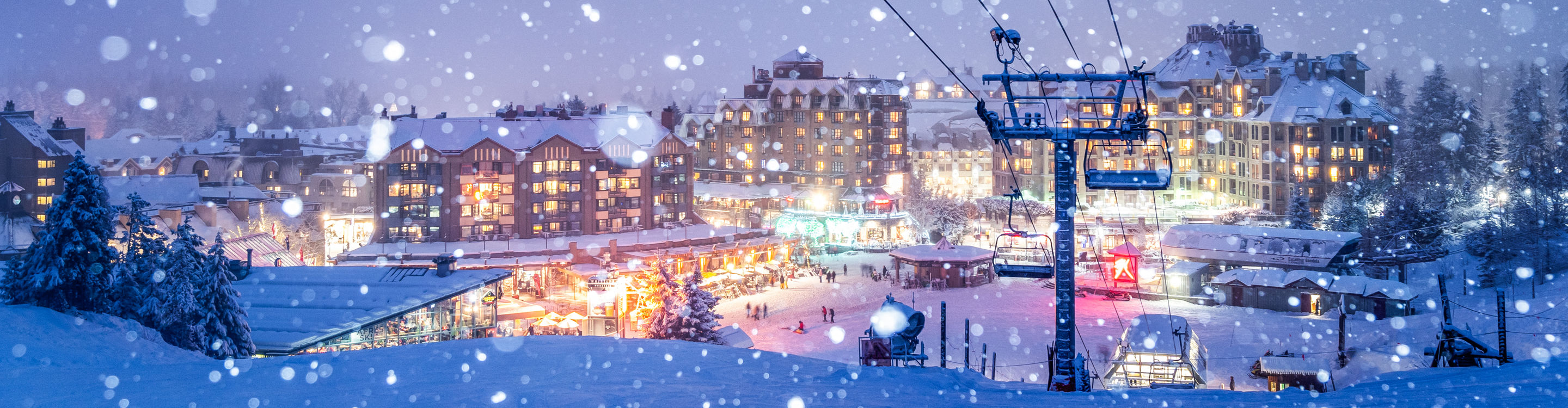 Snowy Whistler Village Glowing at Night