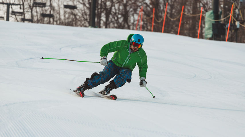 Skier Makes Turns Downhill at Boston Mills