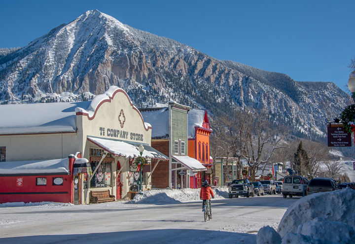 Biker Riding Through Town