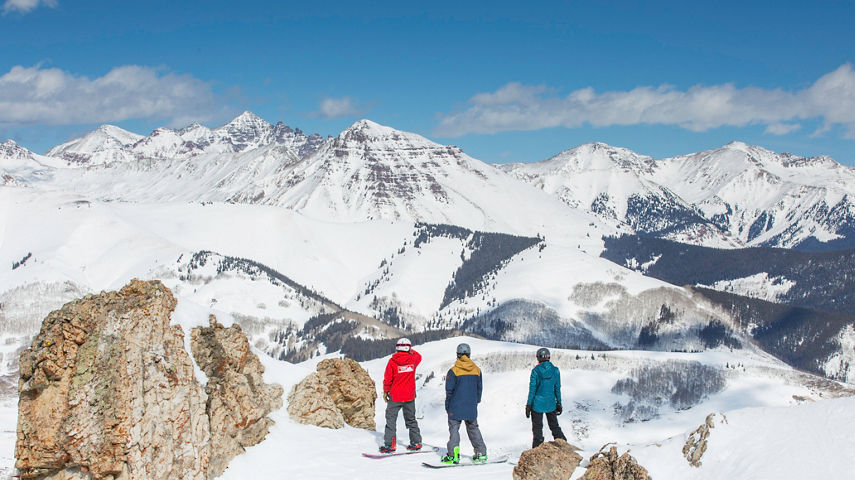 Snowboarding in fresh snow in Crested Butte, CO.