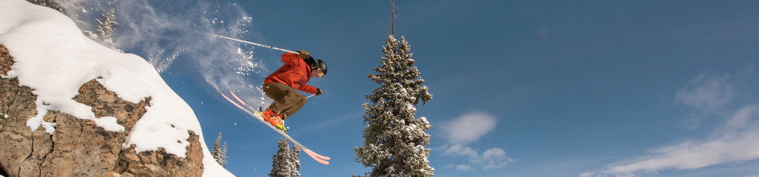 Skier Jumping Off Rocks