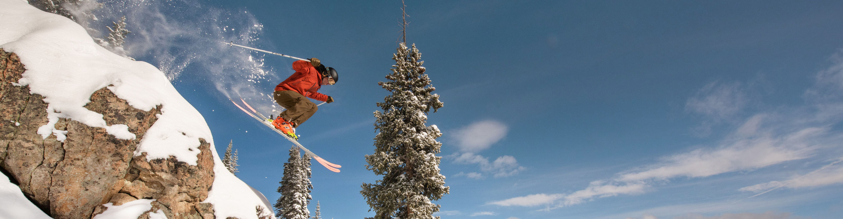 Skier Jumping Off Rocks