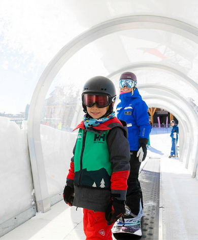 Kids have a snowboard lesson at Stowe, VT.