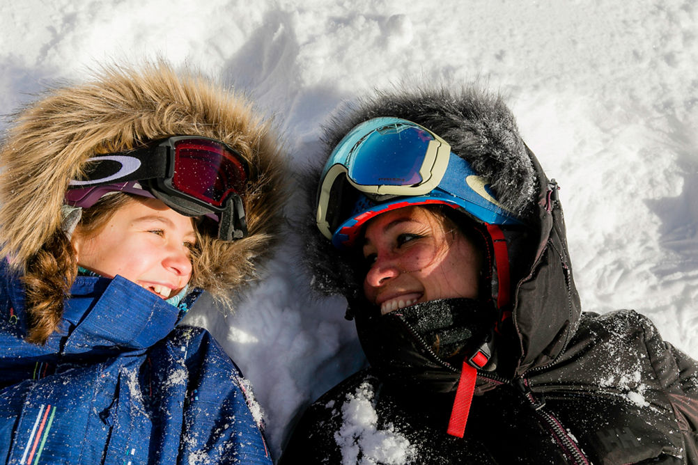 Mother and daughter have a ski day with new snow in Stowe, VT.